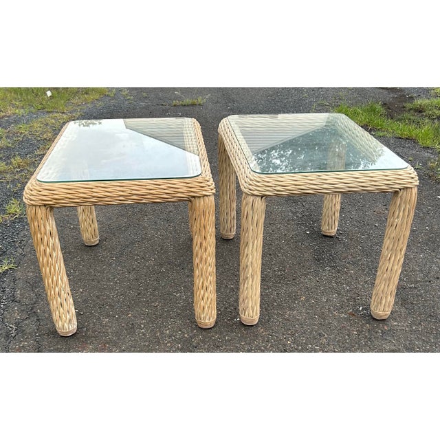 Beautiful pair of vintage wicker side tables with glass tops. Great quality and condition.