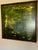This is an evocative oil painting on board of what appears to be a moody lily pond in semi-darkness. It was purchased from...