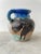 George Johnson, a celebrated ceramics artist from Philadelphia, Pennsylvania, crafted this eccentric urn. A unique...