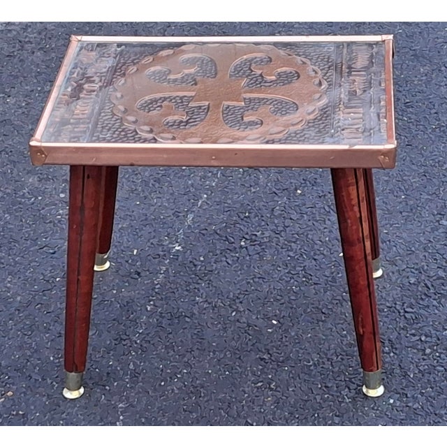 A Gothic Revival Style Copper Clad Wood and Brass capped legs Side Table. Glass top insert. Measures 18" in width, 12" in...