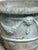 A beautifully aged pair of mid‑century cast‑stone urns, each hand‑poured and finished with the subtle individuality. The...