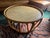 Add a touch of organic warmth and vintage charm to your living space with this stunning rattan coffee table. Its airy,...