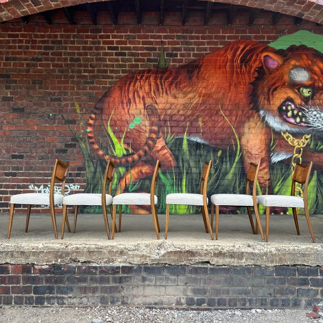 Set of 6 dining chairs designed by Harvey Probber circa 1960s. These chairs feature a mahogany frame, curved and caned...