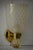 This gold-toned sandblasted Murano glass wall light features a refined and delicate design. The wall light features a...