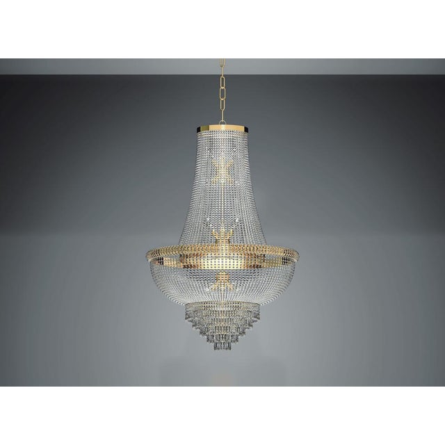 Empire 18 lights chandelier in gold plate and full cut crystal by aggiolight. Dimensions: d 100 x h 157 cm. Materials:...