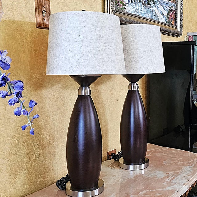 Pair of Contemporary Espresso Wood Hourglass Lamps With Brushed Nickel Accents and Linen Shades For Sale - Image 13 of 18