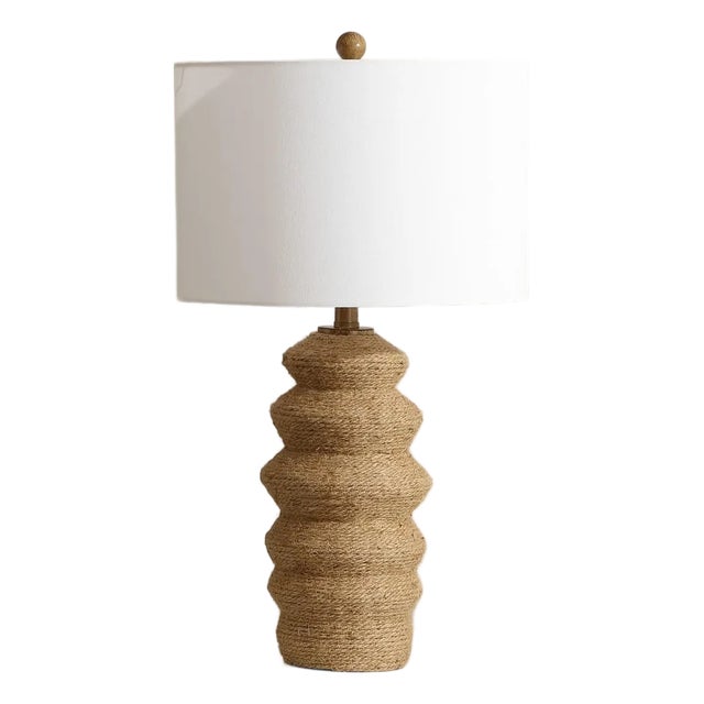 Illuminate your space with the Paola table lamp, measuring 26.5 inches in height. This lamp brings a touch of elegance...