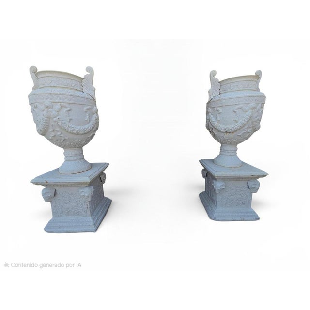 Spectacular pair of monumental garden urns inspired by the forms of ancient Greek vases. Crafted in cast iron and finished...