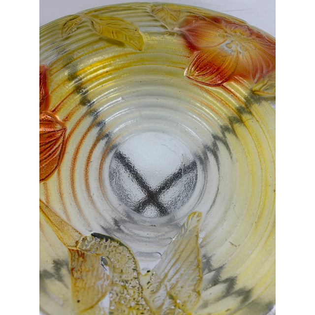 Decorative glass birdbath with embossed floral and hummingbird design in pink, green, and clear glass. Includes black...