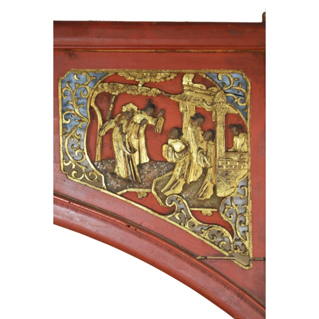 A 19th century Chinese sign with scenes, hand-carved from wood and painted. This large wooden sign, which may have sat...