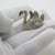 Exemplifying classical Italian decorative elegance, this vintage miniature figurine depicts a detailed swan. Crafted in...
