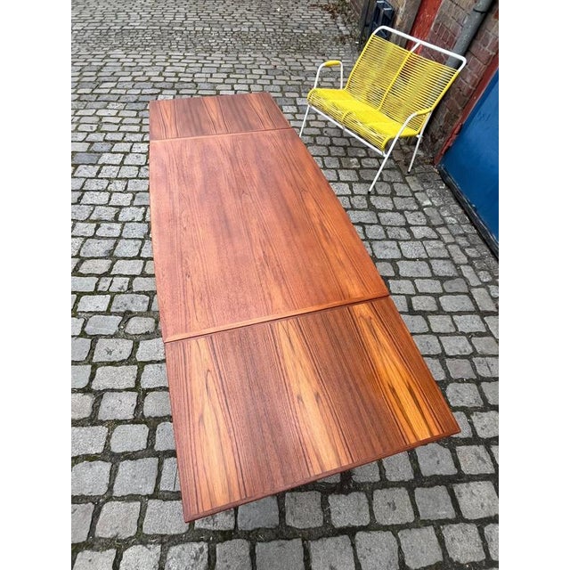 This extendable teak dining table was designed by Grete Jalk for Glostrup Møbelfabrik, a renowned designer of Danish mid-...