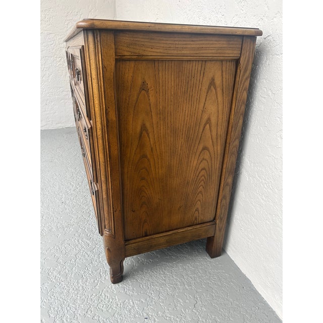 French style Baker Furniture seven draw double dresser with a banded Burlwood veneer top. The dresser is I very good...