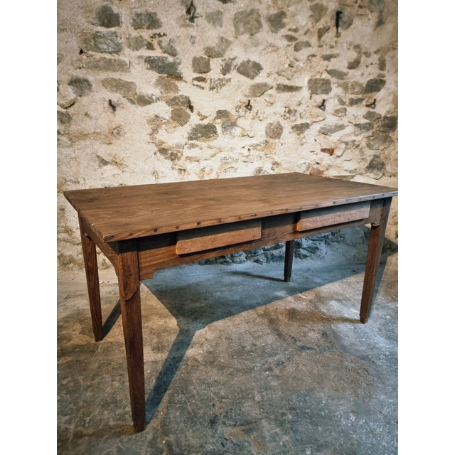 This antique French oak table dates from the early 20th century and is made entirely of solid oak. The table has a simple...