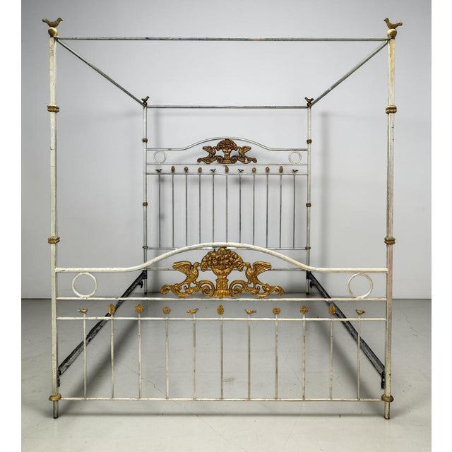 Elevate your bedroom with this striking vintage king-size canopy poster bed, crafted from wrought iron and finished in a...