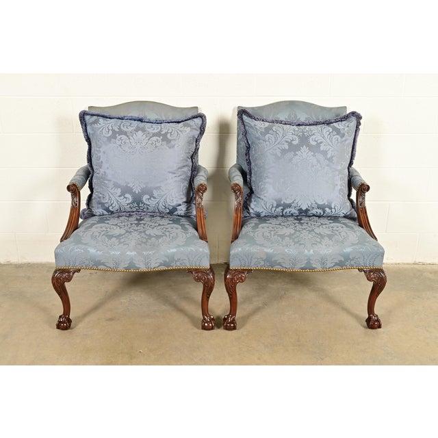 A gorgeous pair of Chippendale or Georgian carved mahogany open arm library chairs or lounge chairs By Kittinger USA, 1991...