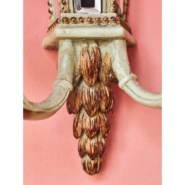 Exceptionally decorative two-armed wall sconce in the spirit of late classicism, decorated with faceted mirror glass, cut...