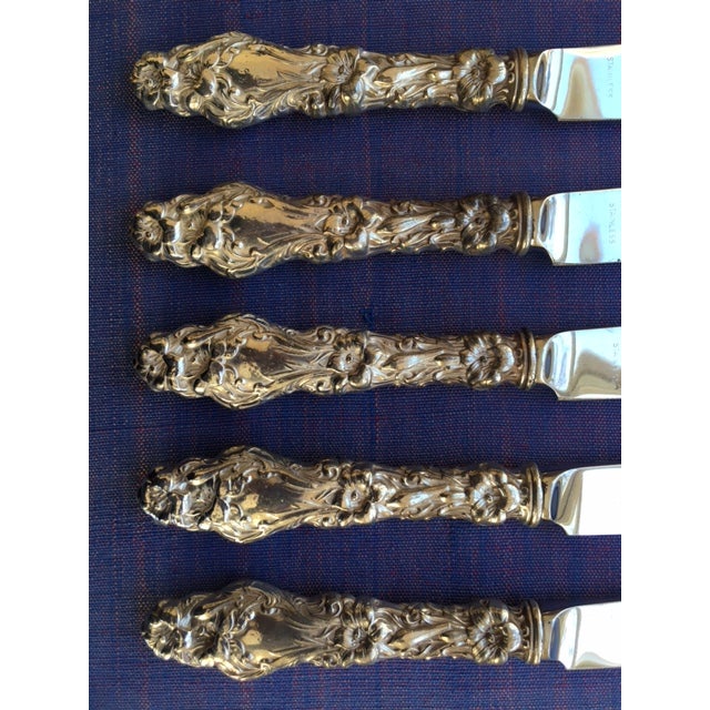 Set of five luncheon knives with sterling silver handles in the Art Nouveau Lily (1902) Pattern by Frank M. Whiting....