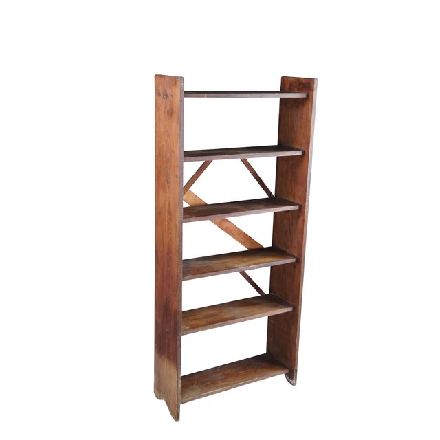 Vintage oak library book shelf featuring primitive styling with six tiers. 26" x 10" x 58" h, shelves 9", bottom shelf 12"