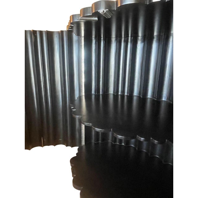 This striking bar cabinet is a sculptural statement piece defined by its dramatic ghostly gradient parchment finish,...