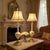 A striking pair of vintage opalescent art glass table lamps, beautifully crafted with frosted, glowing bodies and richly...