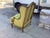 Stunning French Bergere arm chair upholstered in a chic lime green wool fabric. These chairs feature a beautifully carved...
