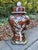 Striking pair of vintage ceramic table lamps in classic ginger-jar form, decorated with hand-painted-style white flowering...