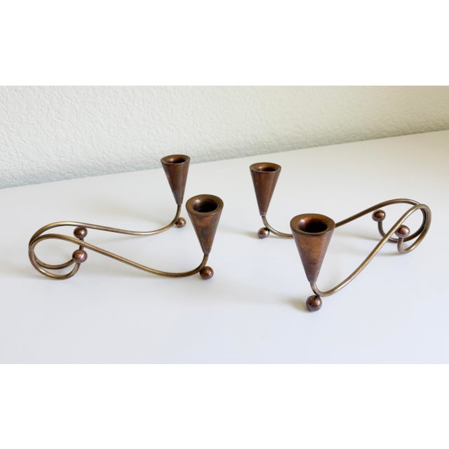 A pair of 1950s to 1960s mid-century modernist mixed-metal candelabras styled after the famous Mexican Los Castillos...