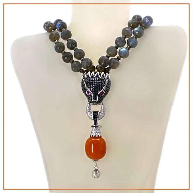 This is a double strand necklace we created with 10 mm charcoal grey translucent faceted with a glass-like luster...