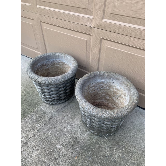 A beautifully weathered pair of vintage cast concrete planters featuring an exceptionally detailed trompe-l'œil...