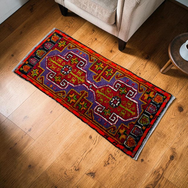 Welcome to our curated collection of authentic Anatolian textiles. This stunning vintage miniature rug perfectly blends...
