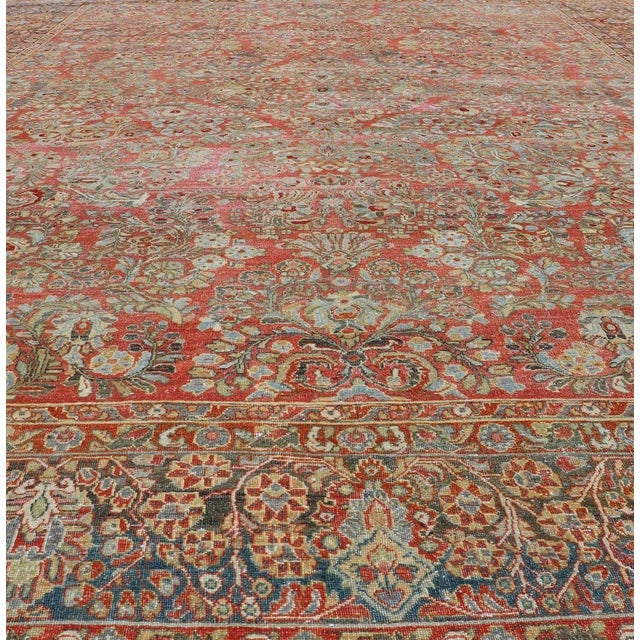 Antique Persian Sarouk with all-over floral design on a light red field. Keivan Woven Arts / J10-1101, country of origin /...
