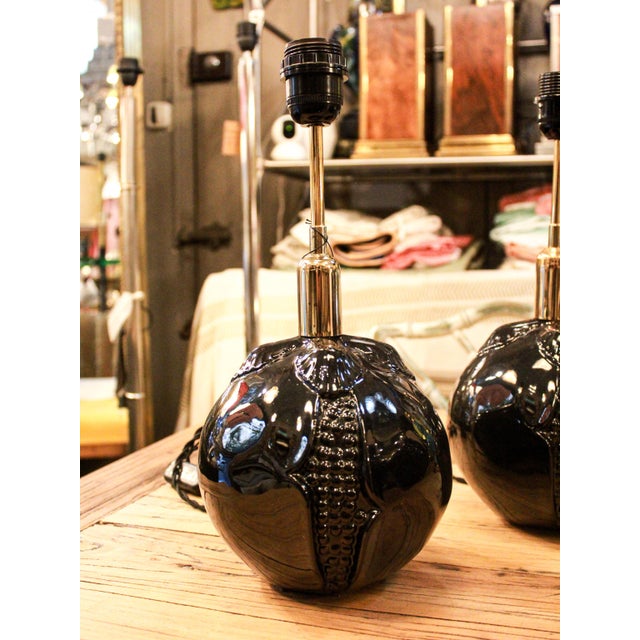 Pair of spherical ceramic lamps from Manises, decorated with a relief motif that evokes a pomegranate. European Plug (up...