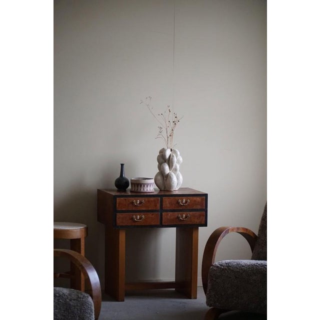 This Danish Art Deco small console table, crafted in the 1940s by a skilled Danish cabinetmaker, exudes timeless elegance...