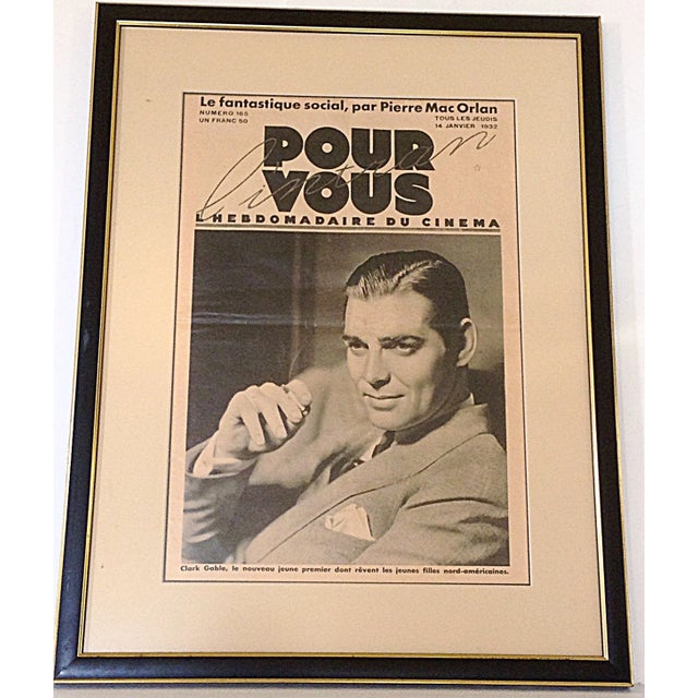 An original French movie poster from 1937 of Clark Gable framed in black and gold wood frame.