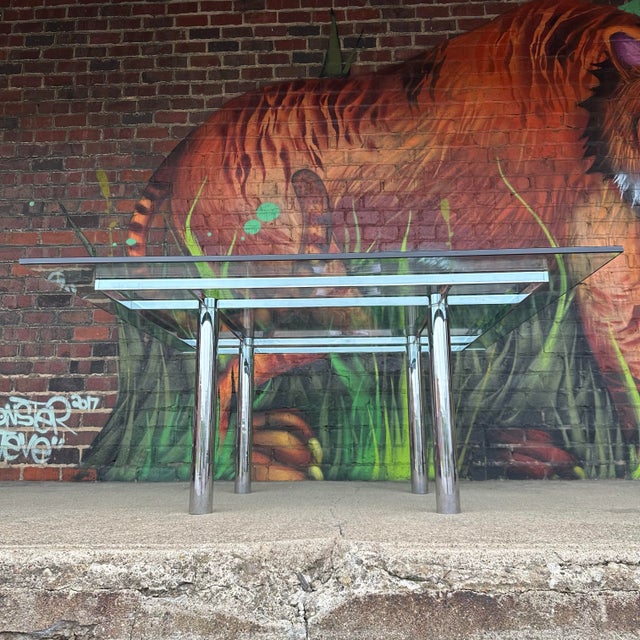 This table makes a colossal statement! Glass and chrome coffee table designed by Afra and Tobia Scarpa for Knoll. The...