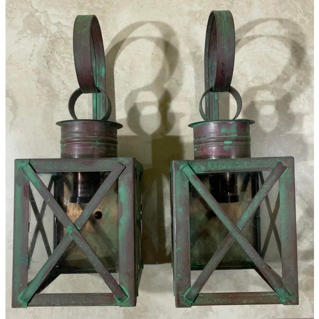 Pair of wall lantern made of solid copper, protective X bars, weathered patina, with one 75/watt light each. Suitable for...