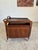 Gorgeous mid century modern rolling bar cart, featuring sculpted rosewood with a black laminate inlay top that extends...