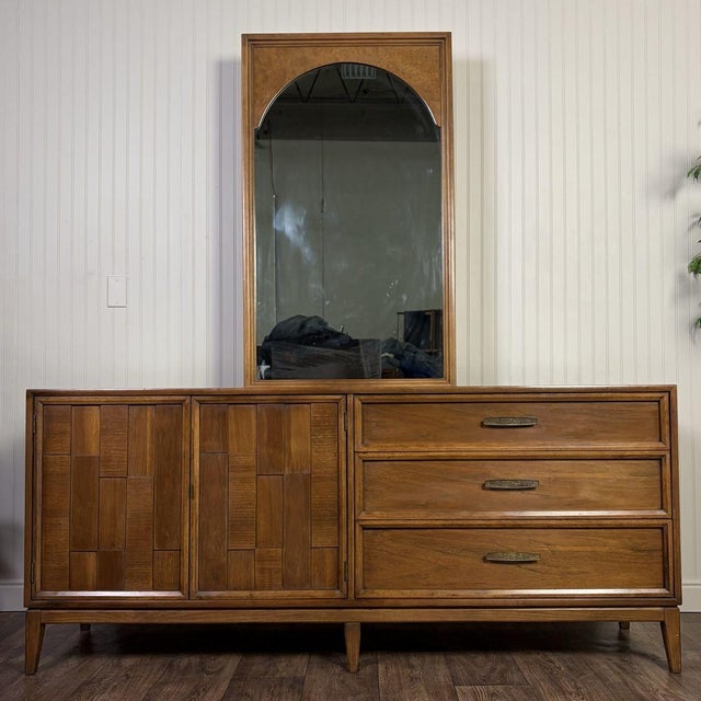 Vintage Kroehler Custom Crafter dresser or credenza with a matching arched mirror, finished in warm walnut veneer with a...