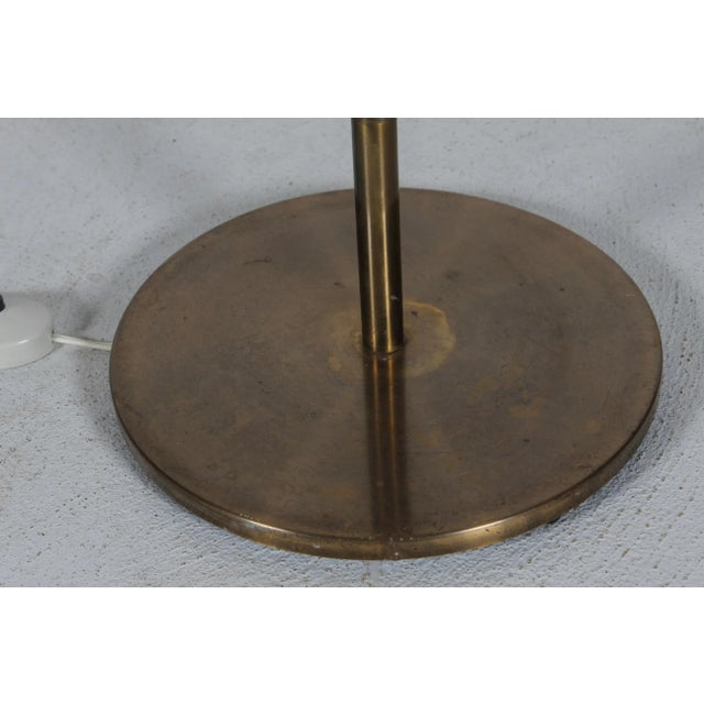 Tall Mid-century Danish floor lamp in Jo Hammerborg style 1960s. The floor lamp is made of teak, metal with black lacquer...