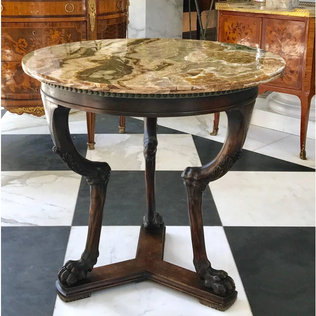 This extraordinary neoclassical side table is hand carved in the mid 19th century in Italy. Made of walnut with a rare...