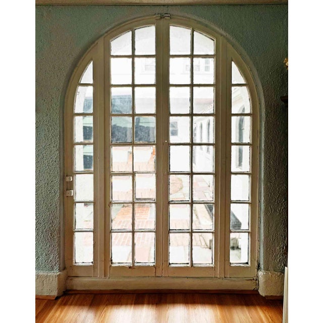 Pair of antique arched French terrace doors. We also have corresponding matching windows.