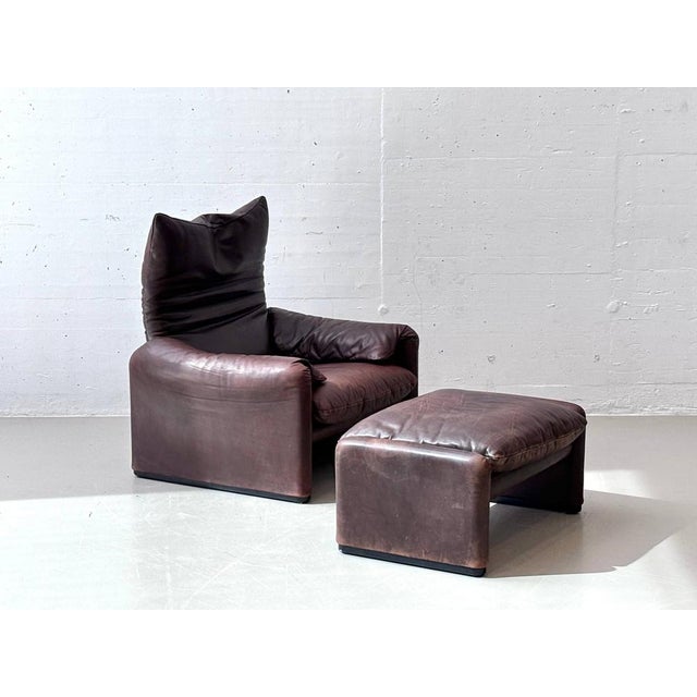 The iconic "maralunga" lounge chair with matching ottoman, designed by vico magistretti for cassina in the 1970s. This...