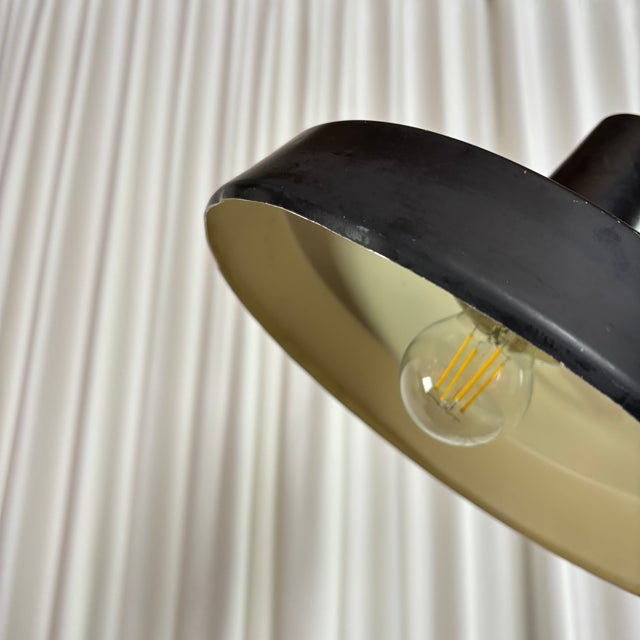 Vintage Mid-Century Modern counterweight floor lamp, signed Boulanger. Made in Belgium in the 1960s. Its black and chrome...