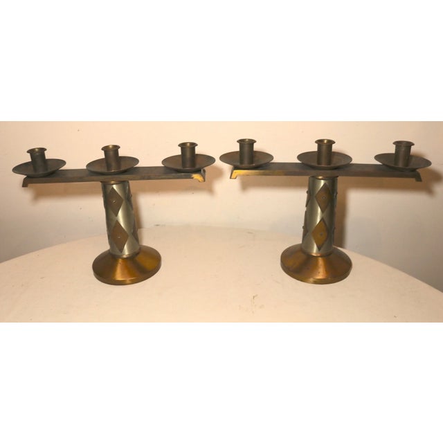Up for sale is a very nice quality pair of vintage Arts and Crafts bronze altar candlesticks. The candle holder feature...