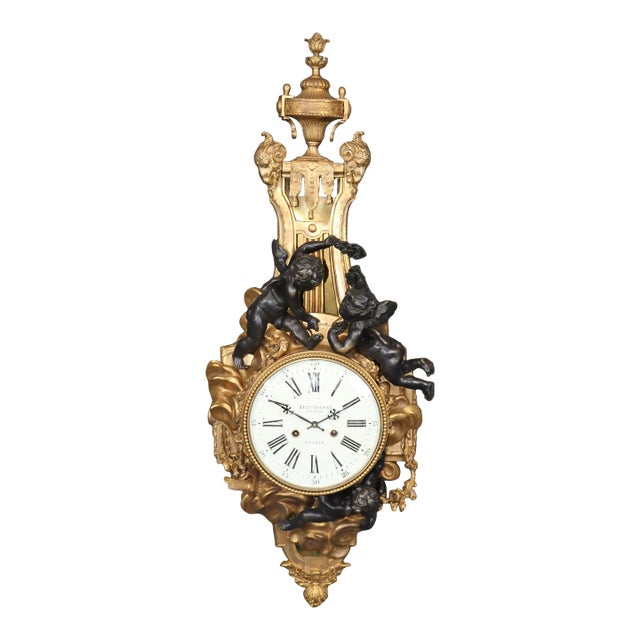 Rare Eugene Bagues Dark and Bright Bronze French Cartel Clock With Putti For Sale