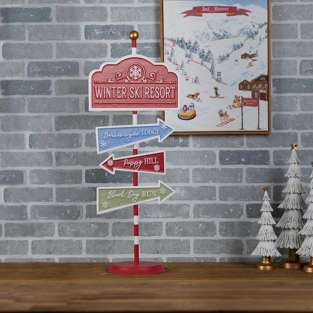 Add a playful touch to your holiday decor with this Whimsical Dog Ski Resort Sign. This charming metal sign features...