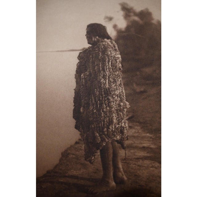 An original vintage photogravure from Edward S. Curtis's landmark The North American Indian. Mohave Man is a full-length...