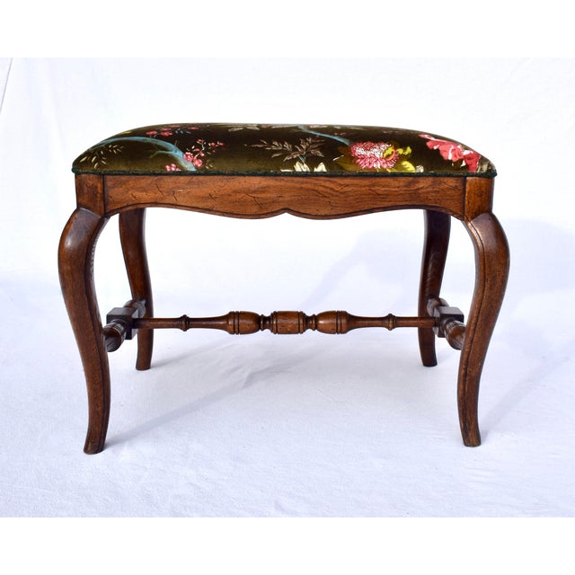 Solid Oak French style bench stool ottoman upholstered in Brunschwig & Fils floral velvet. Striking ground color is of...