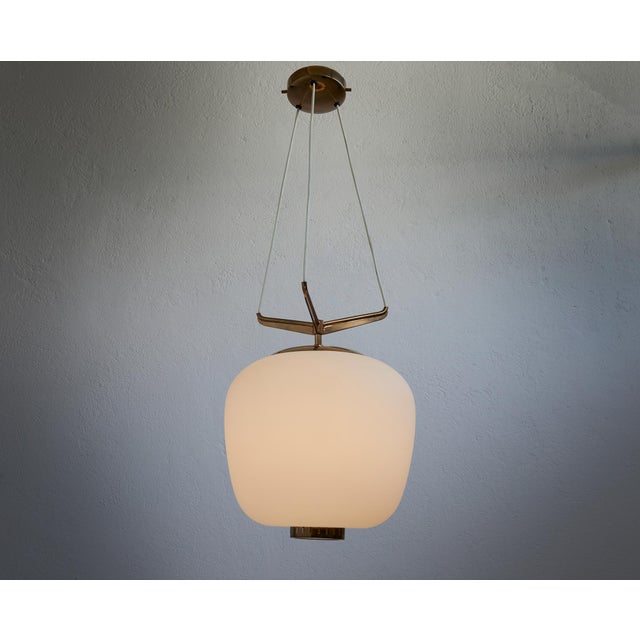 Opaline Glass and Brass Chandelier from Stilnovo, Italy, 1950s, in Flawless conditions. Designed 1950 to 1959 I have...